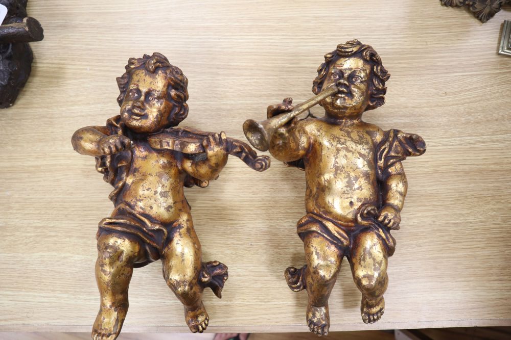 A pair of plaster cherubs and a Sitzendorf porcelain centrepiece